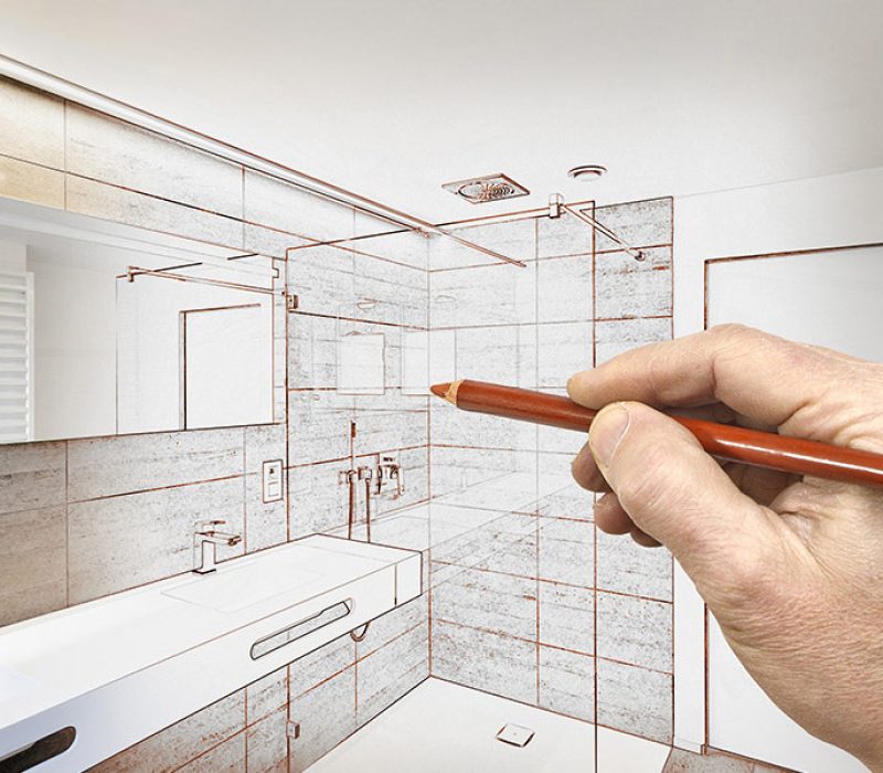 a hand with pencil in hand showing a bathroom graphical representation